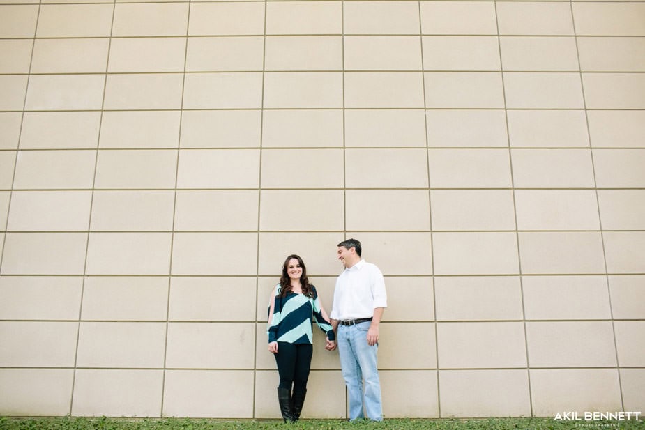 Couple against a geometric architectural backdrop