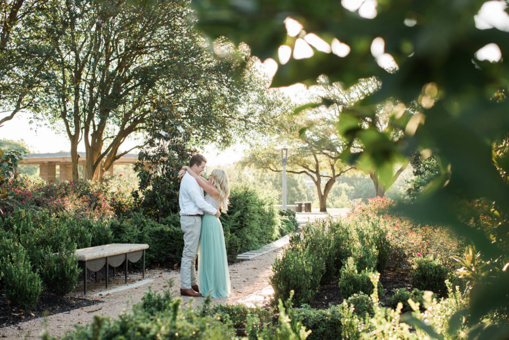 Couple taking engagement photos at Eleanor Tinsley Park