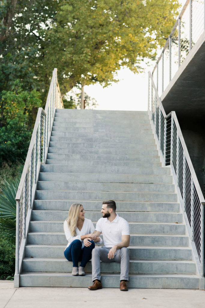 Couple taking engagement photos at The Dunlavy