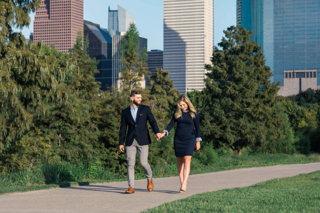 Couple taking engagement photos at Eleanor Tinsley Park