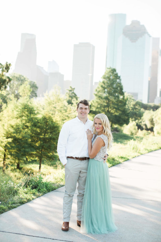 Couple taking engagement photos at Eleanor Tinsley Park