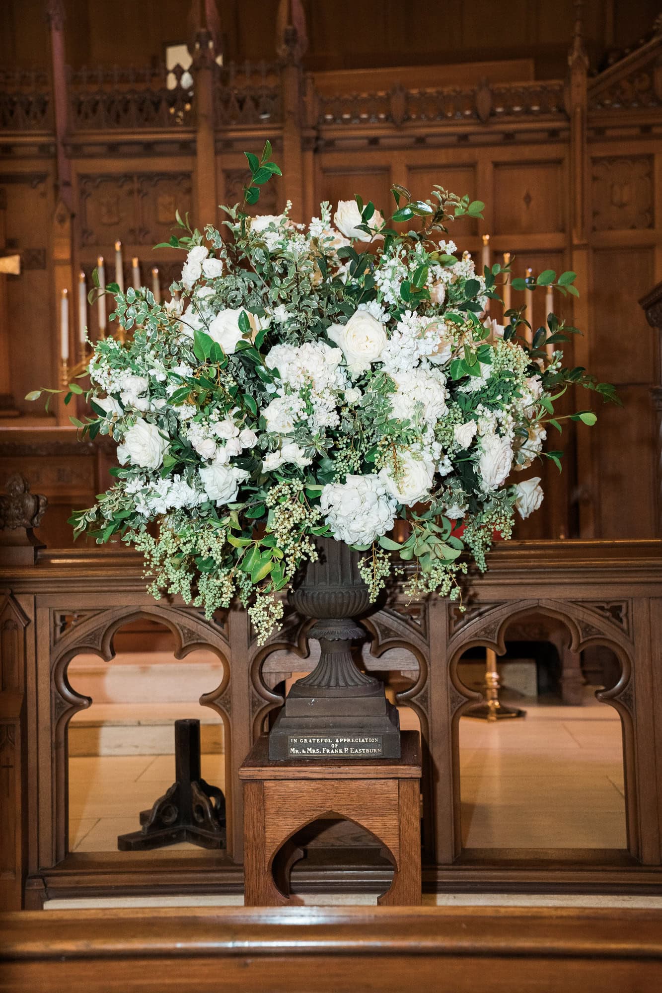 White flowers and greenery arranged in an urn inside St. Paul’s.